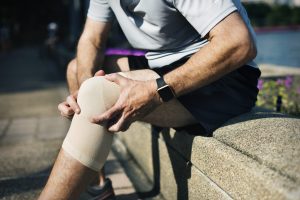 Elderly man having a knee injury Elderly man having a knee injury
